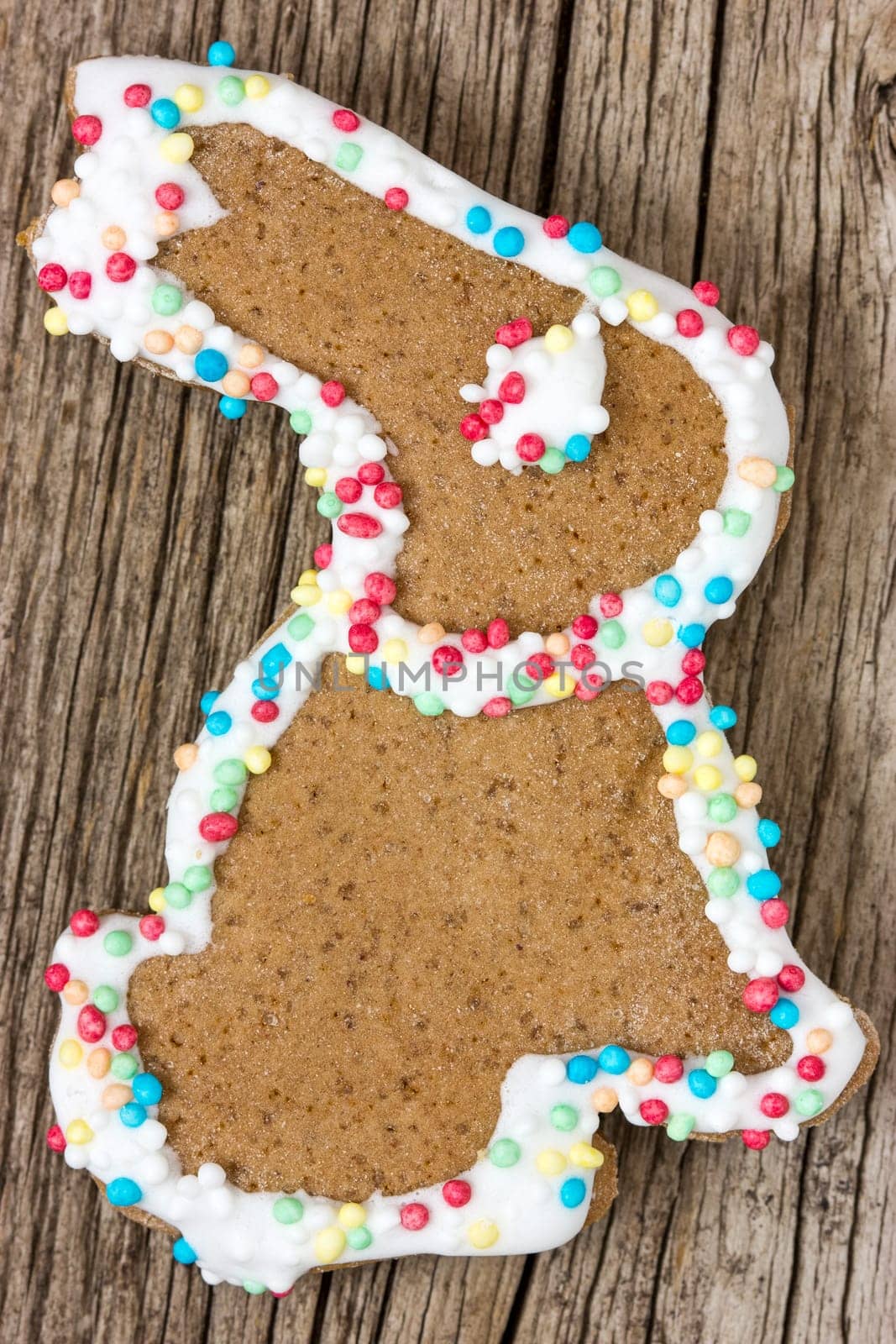 Easter bunny gingerbread cookie on the wooden background