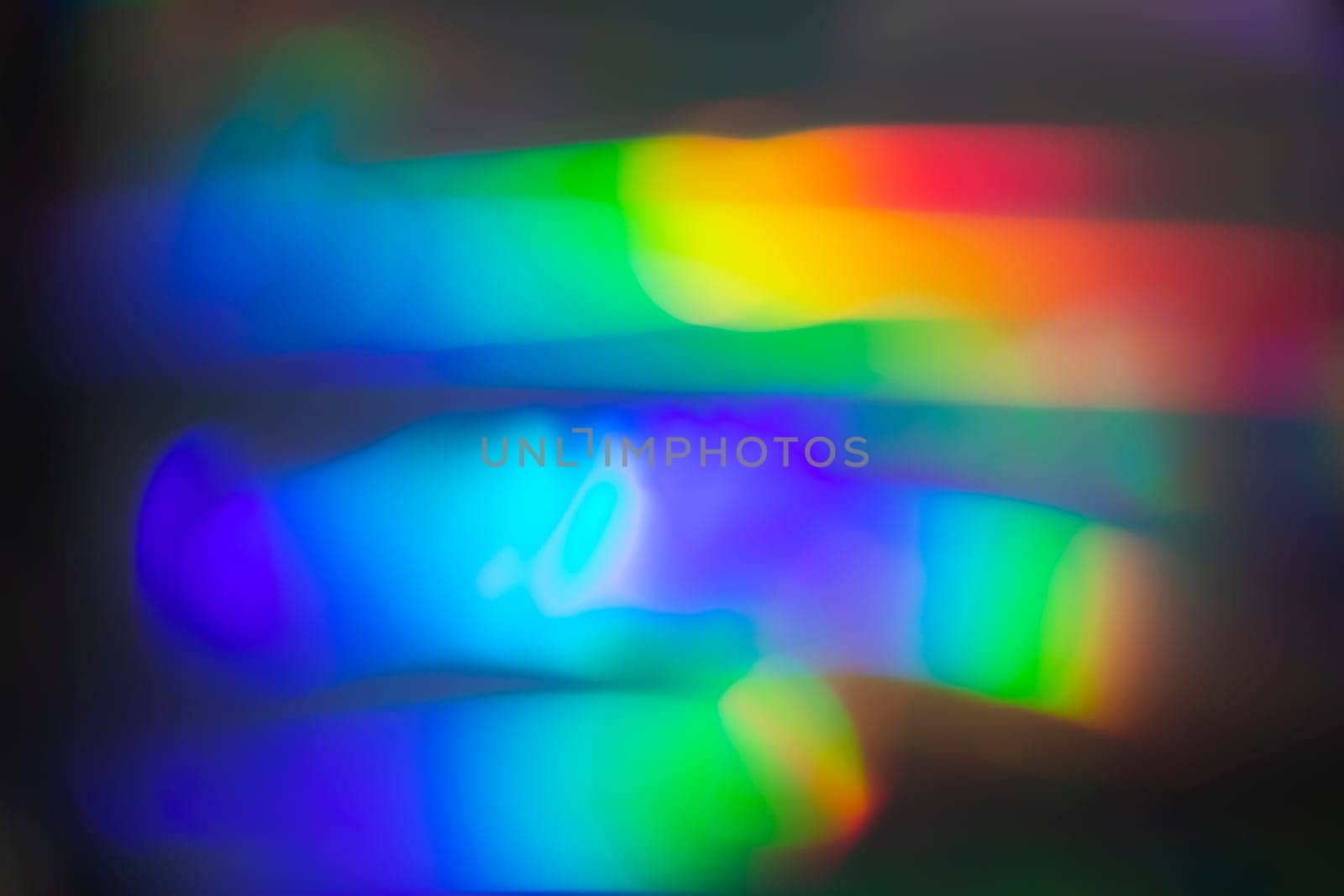 Rainbow holographic bokeh background. Multicolored overflows of color.