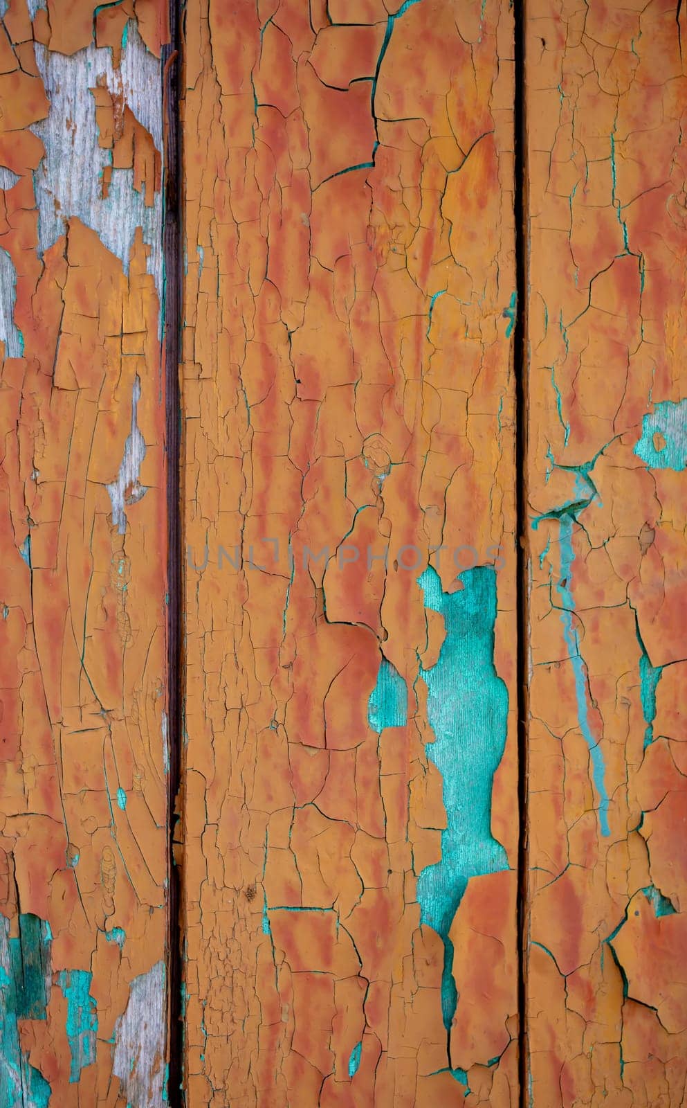 Vertically wooden old board with blue paint spots. Vintage wooden background.