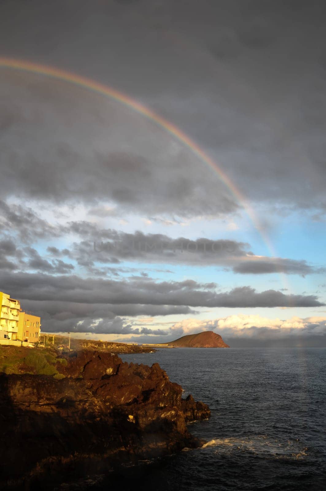 Colored Rainbow over a Cloudy Sky in Tenrife Canary Islands