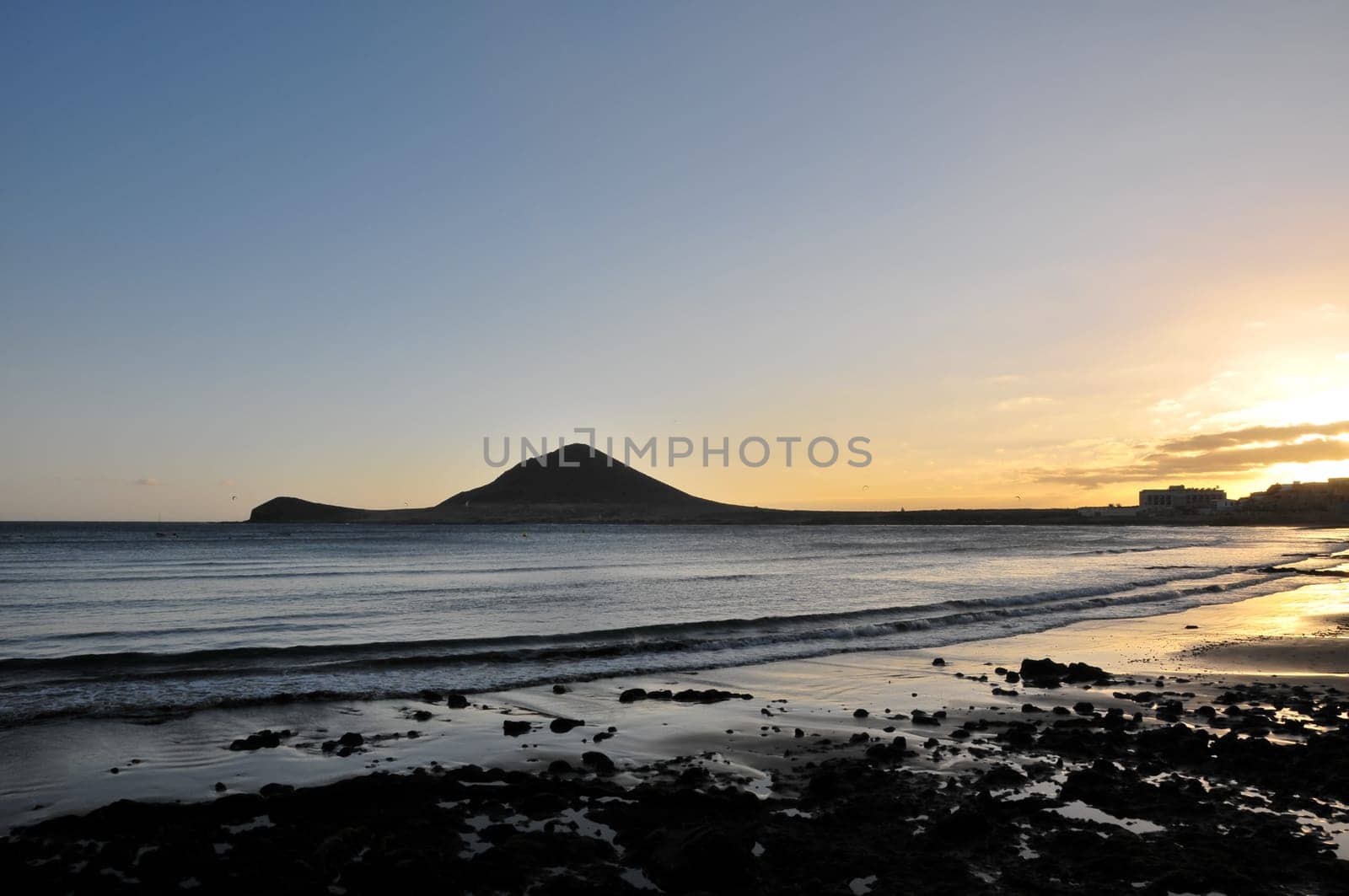 Sunset on the Atlantic Ocean with a Mountain in Background El Medano Tenerife Canary Islands Spain