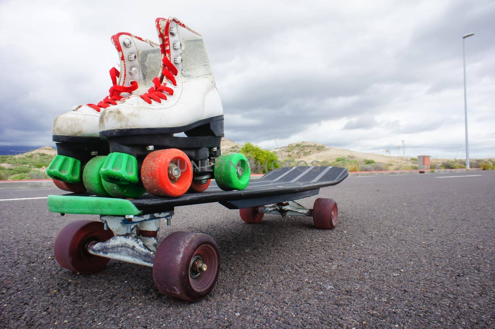 Vintage Style Longboard Black Skateboard on an Empty Asphalt Desert Road