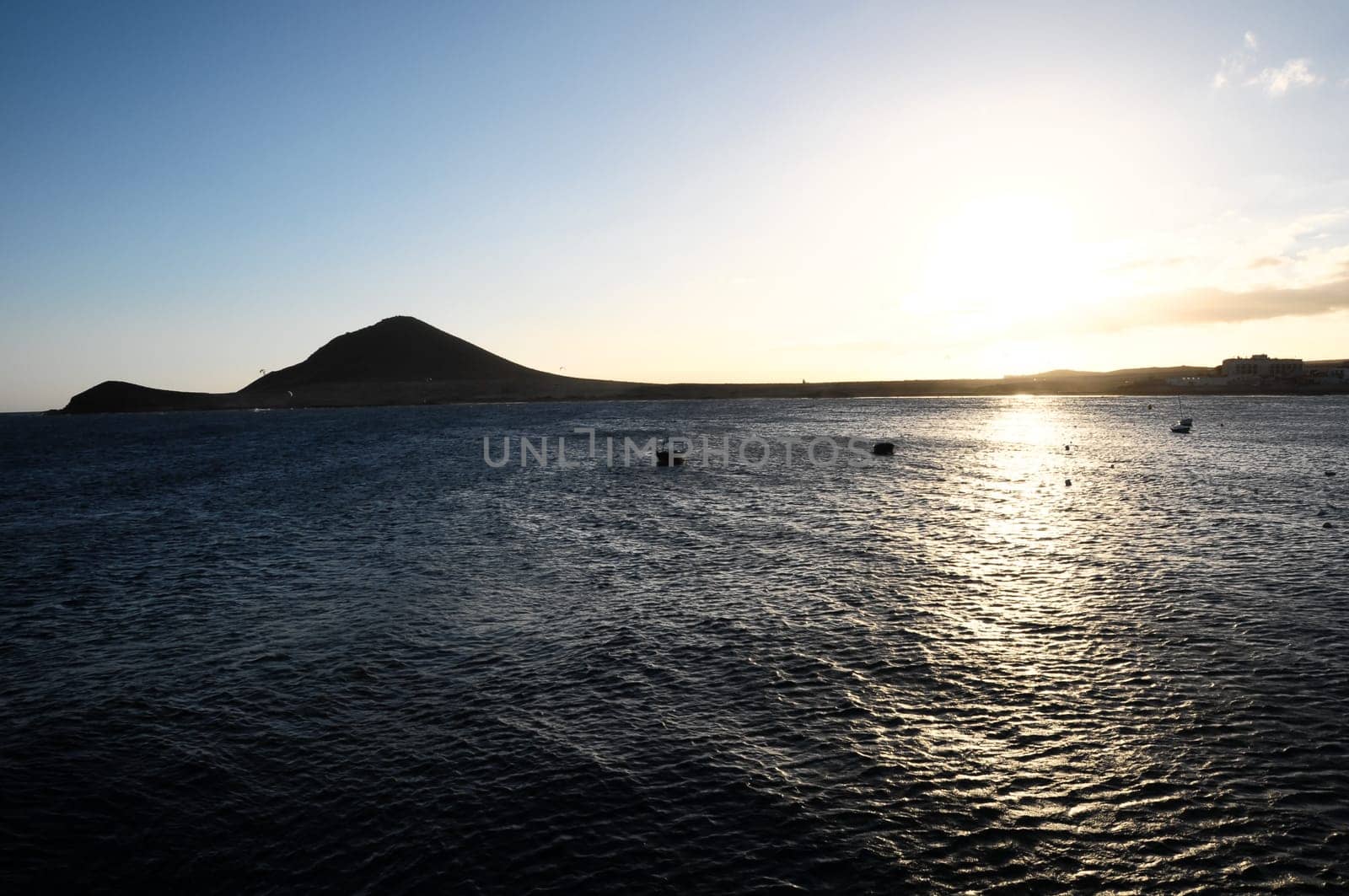 Sunset on the Atlantic Ocean with a Mountain in Background El Medano Tenerife Canary Islands Spain