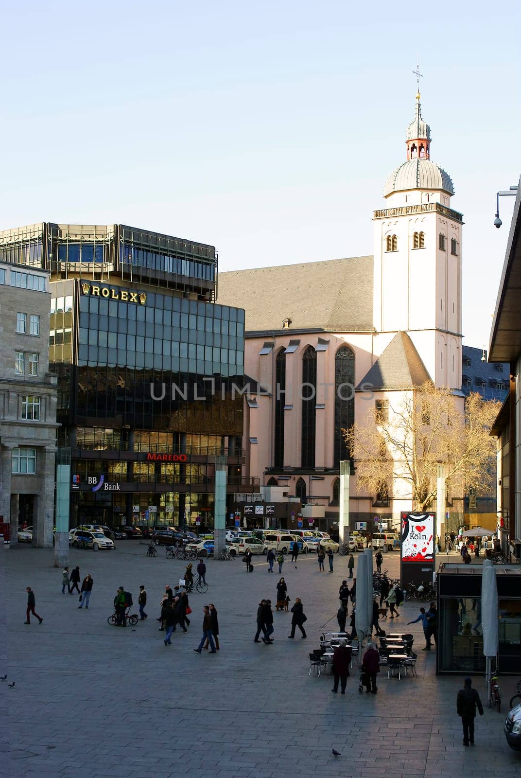 Cologne,Germany – February 02,2014: Tourists and travellers on the station forecourt in Cologne with a view of St. Mary's Assumption Church on 02 February 2014 in Cologne.