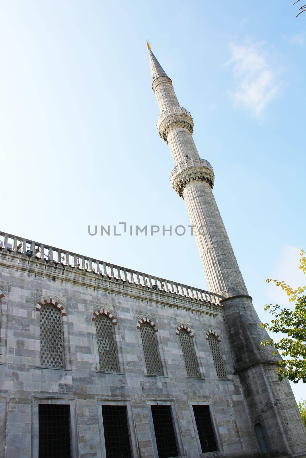 A closeup view of the minaret of the mosque in Istanbul, Turkey...