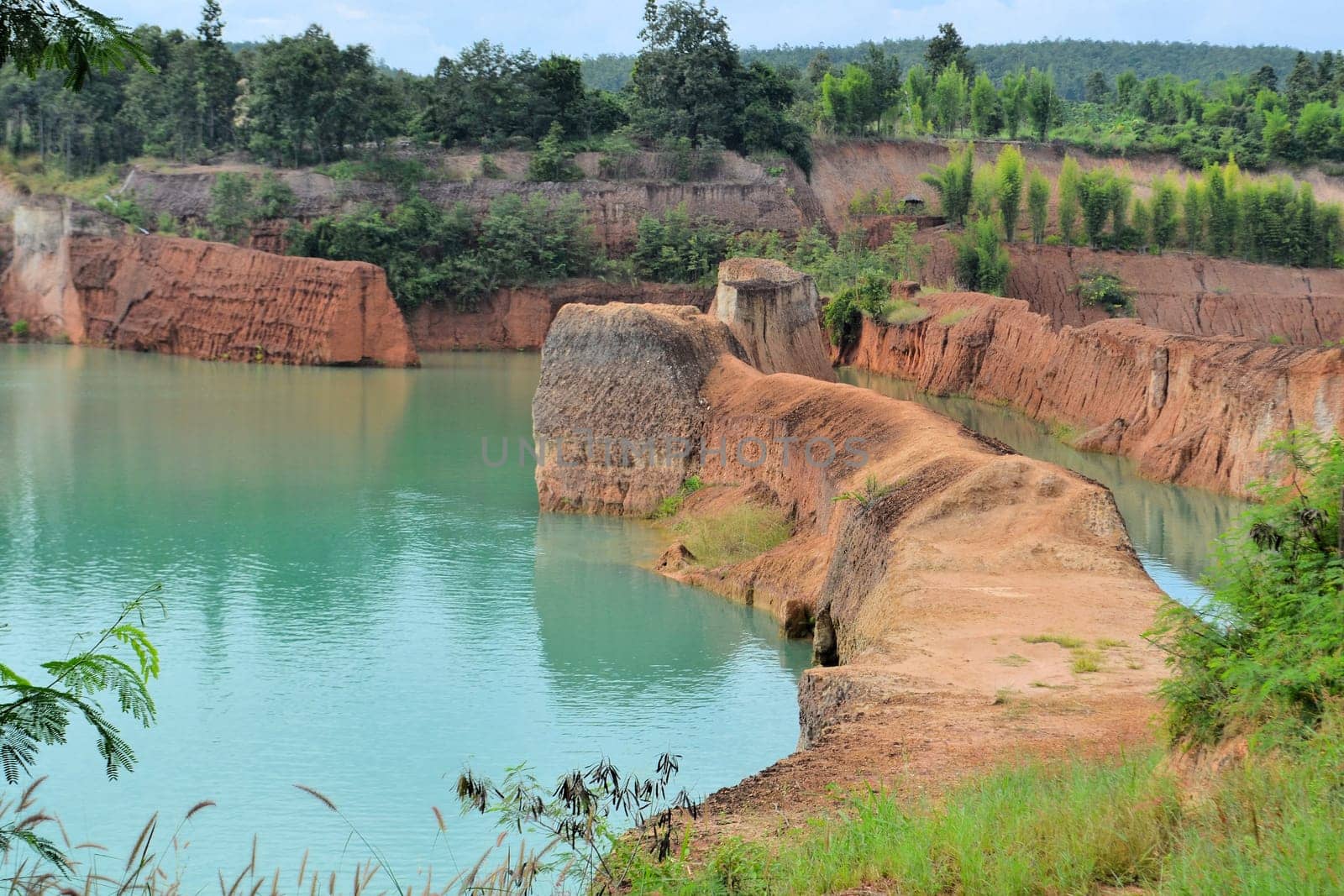 popular quarry pond for swimming and outdoor life, lake at excavation site in Opkhan national park near Chiang Mai, Thailand
