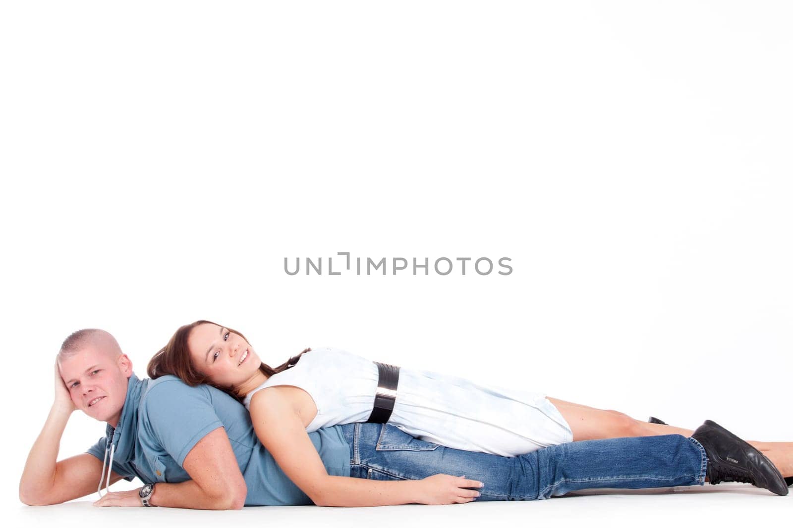 Young adults in a white studio having fun