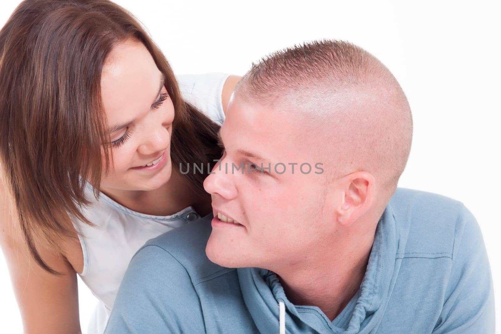 Young adults in a white studio having fun
