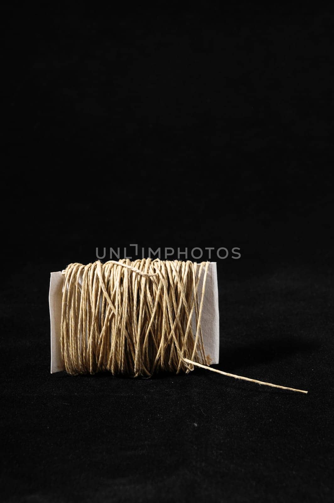 Roll of Twine isolated on a Black Background
