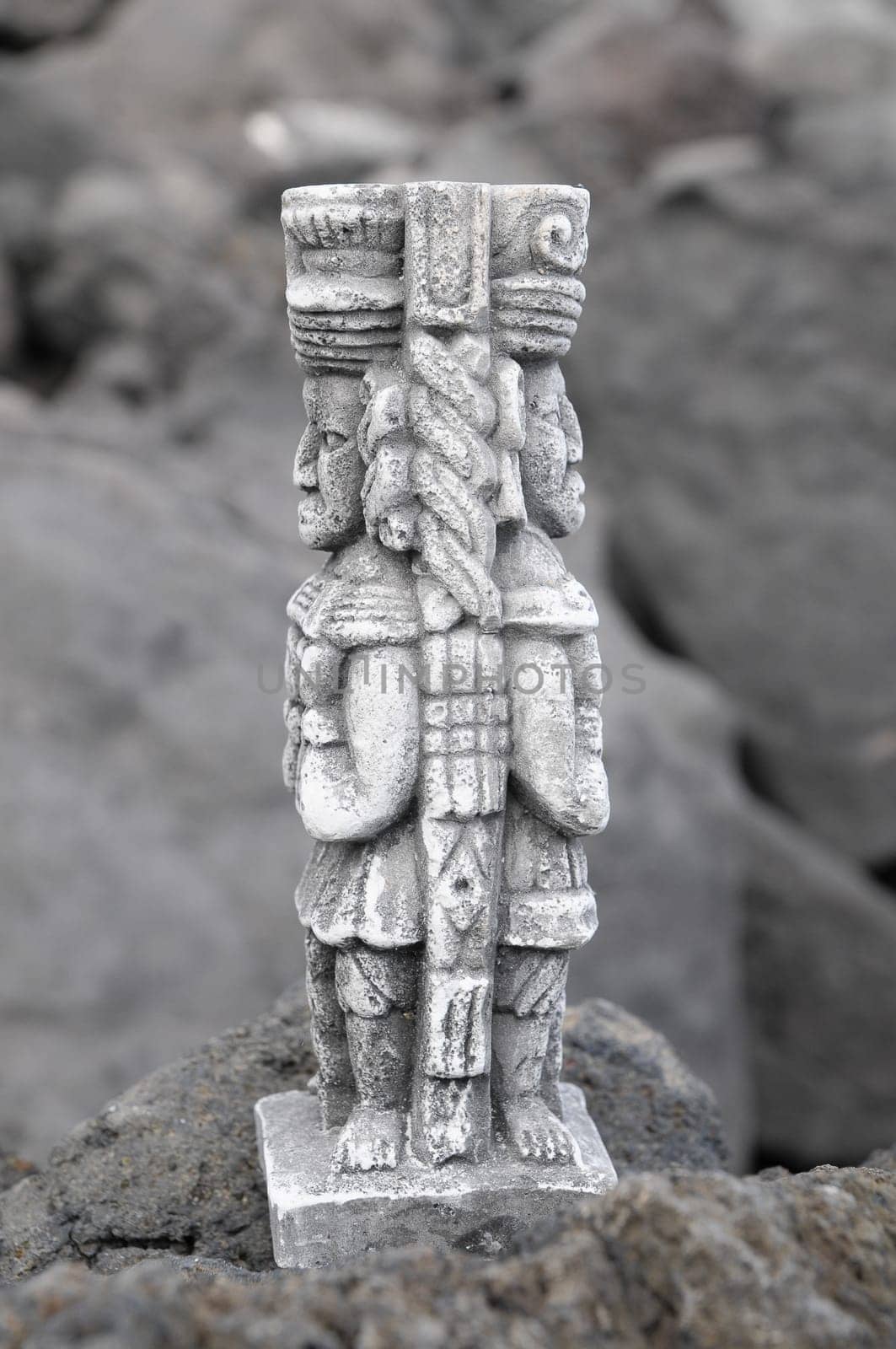 Ancient Maya Statue on the Rocks near Ocean