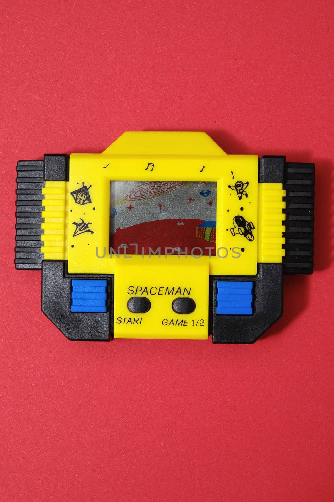 One Old Yellow Vintage Videogame with four Buttons