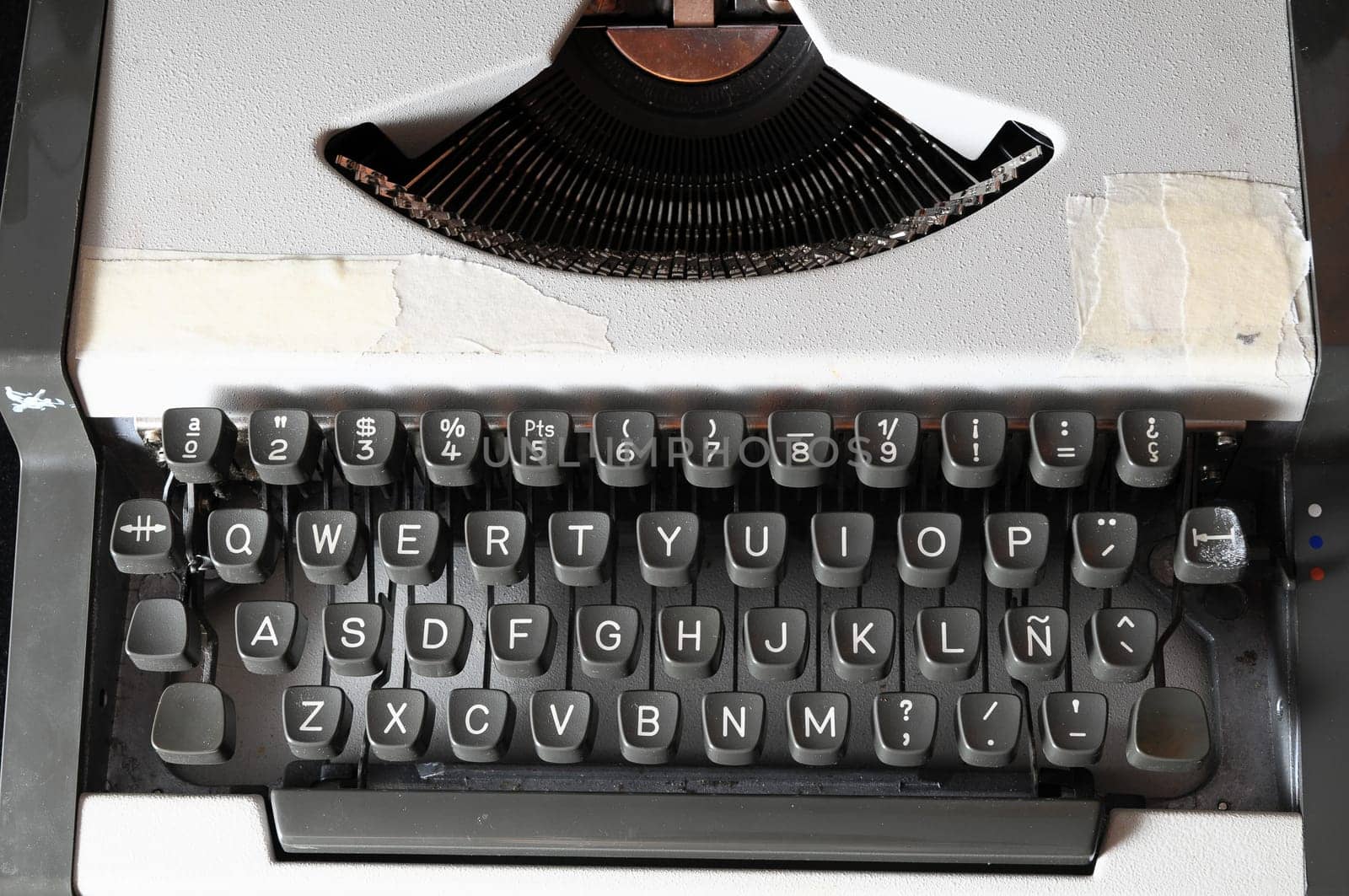 An Old Travel Vintage Typewriter on a Black Background