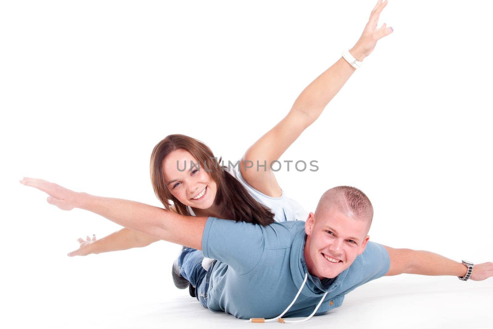 Young adults in a white studio having fun