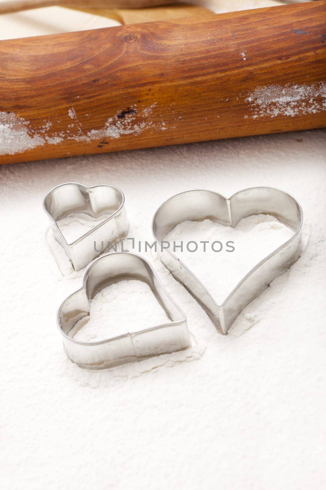 Cutters in heart shape and dough roll