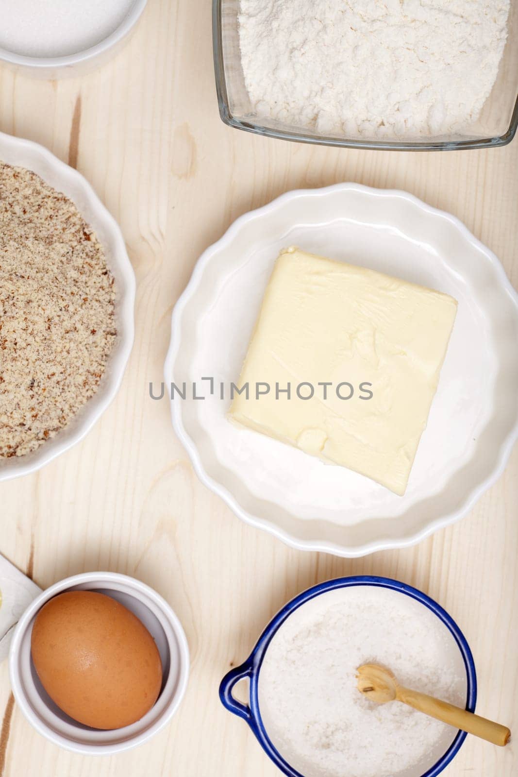 Baking ingredients in bowls on a board