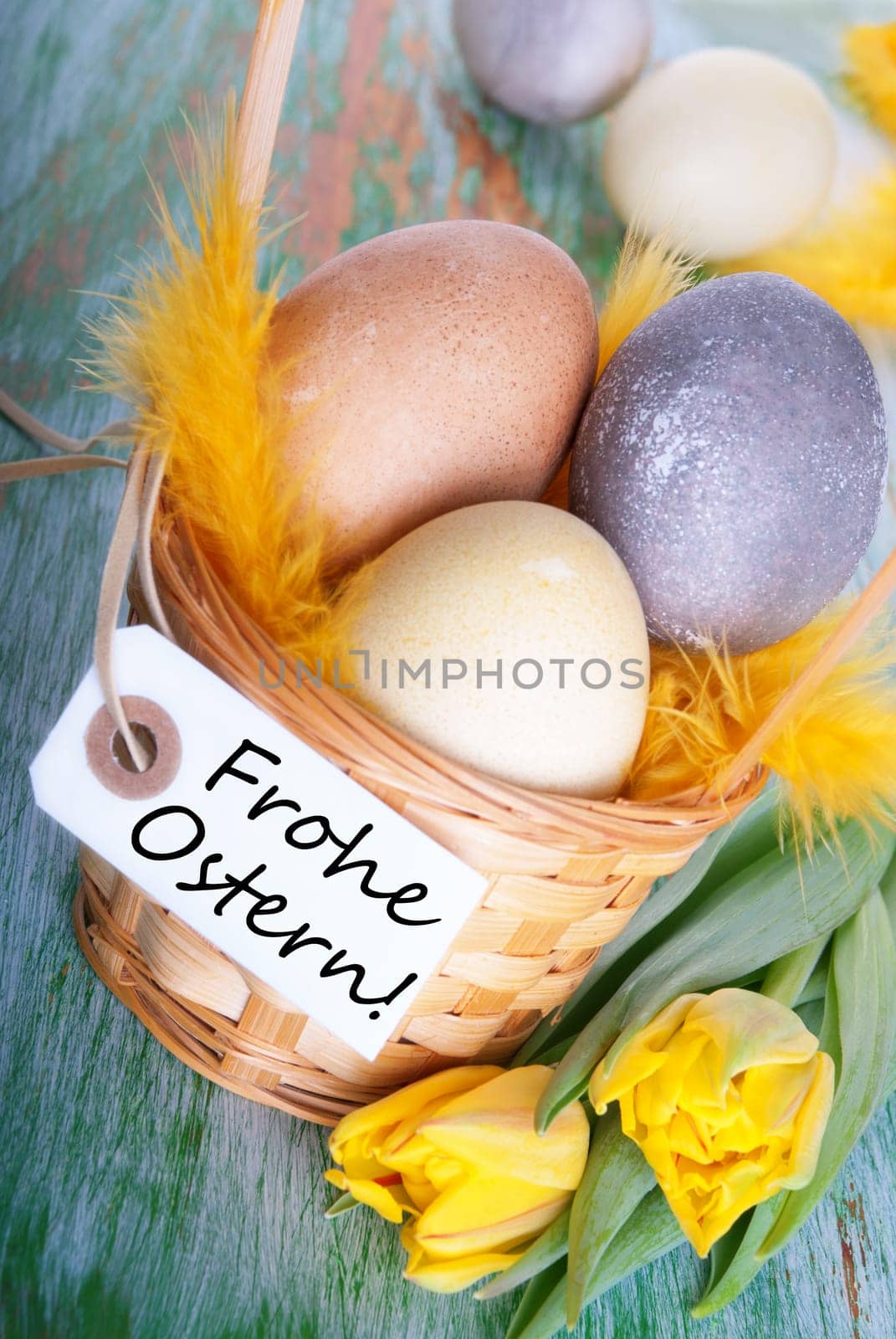 Eggs in a Basket with a Label with the German Words Frohe Ostern which means Hapy Easter