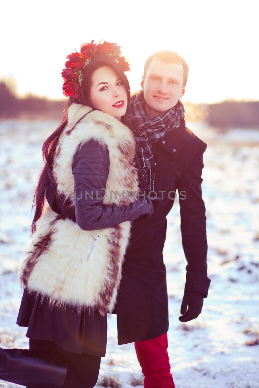 Healthy walk in winter on the frozen field covered with snow