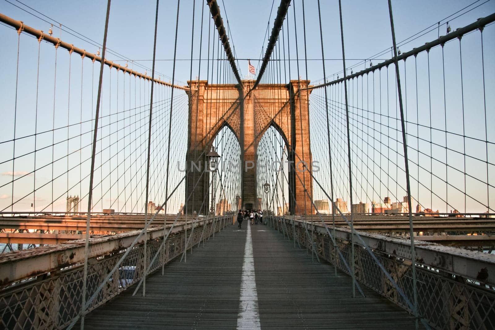 Local people and tourists walking Brooklyn bridge
