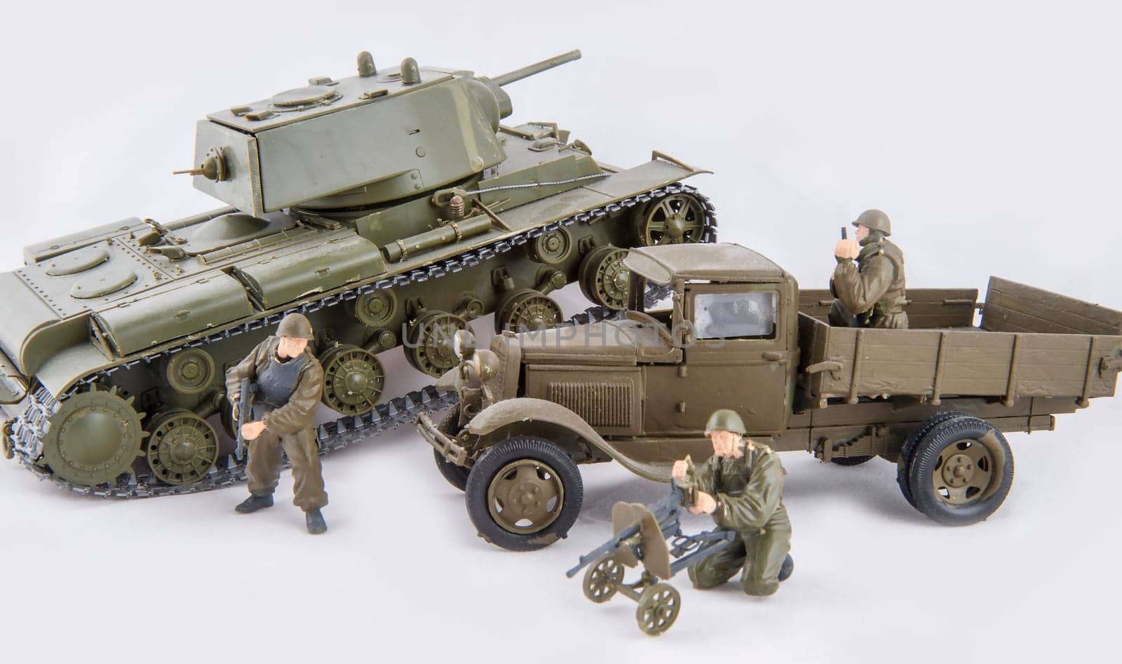 Installation of combat with children's toys on a white background