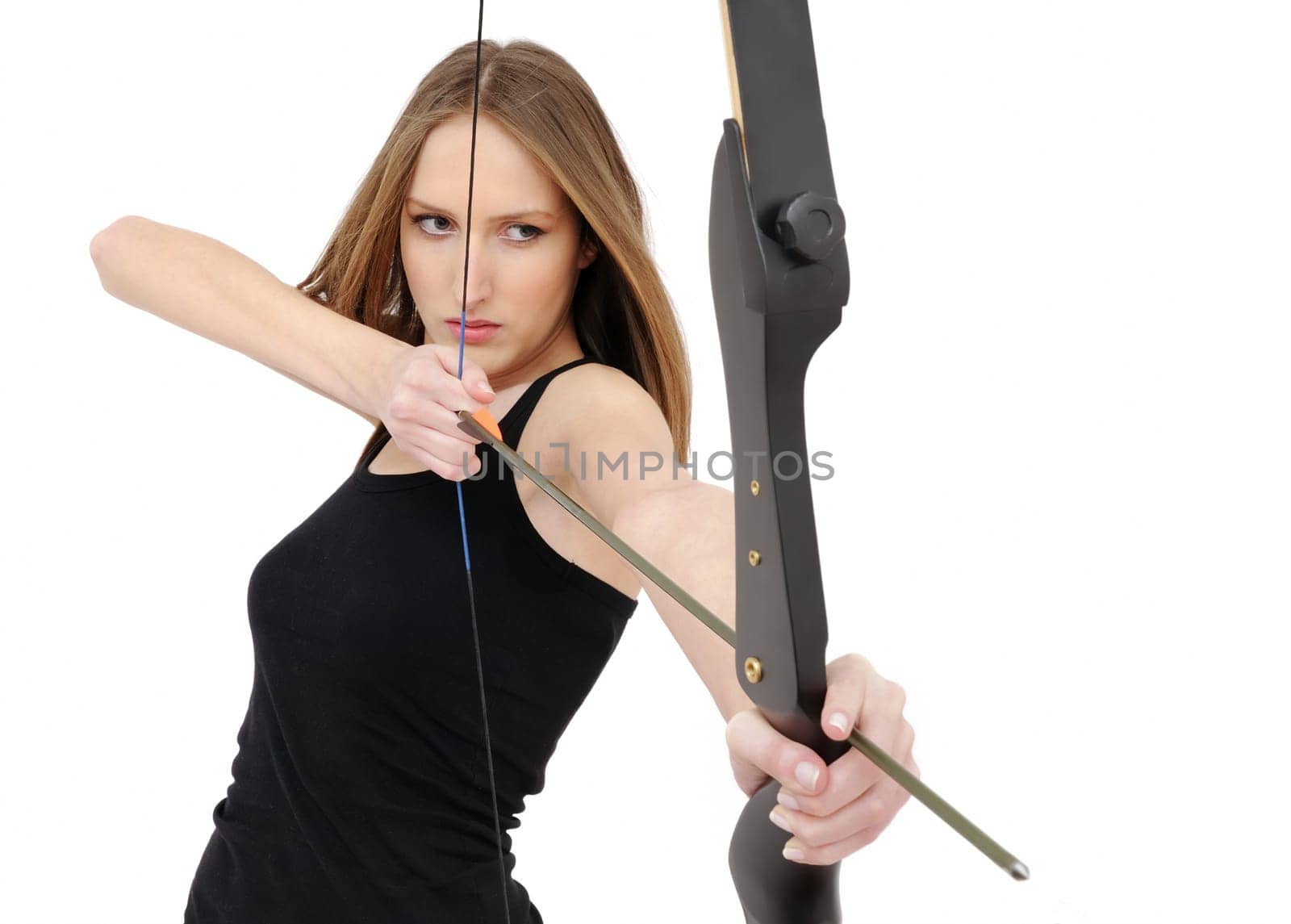 Beautiful woman aiming with bow and arrow