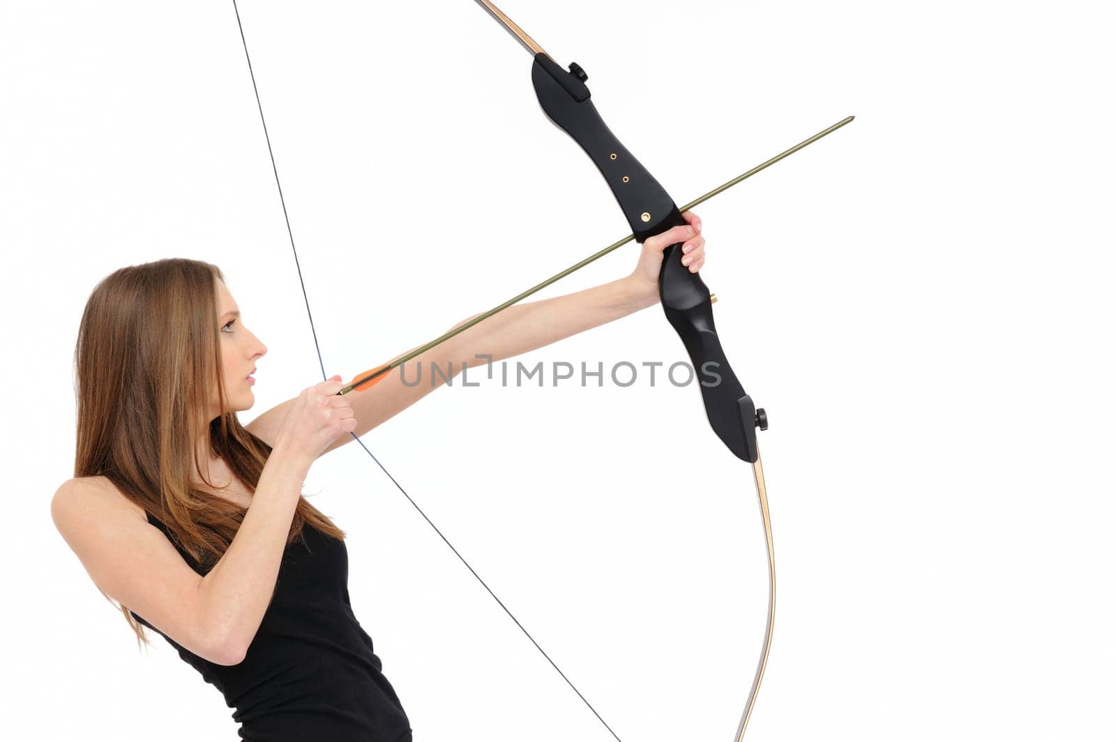 Beautiful woman aiming with bow and arrow