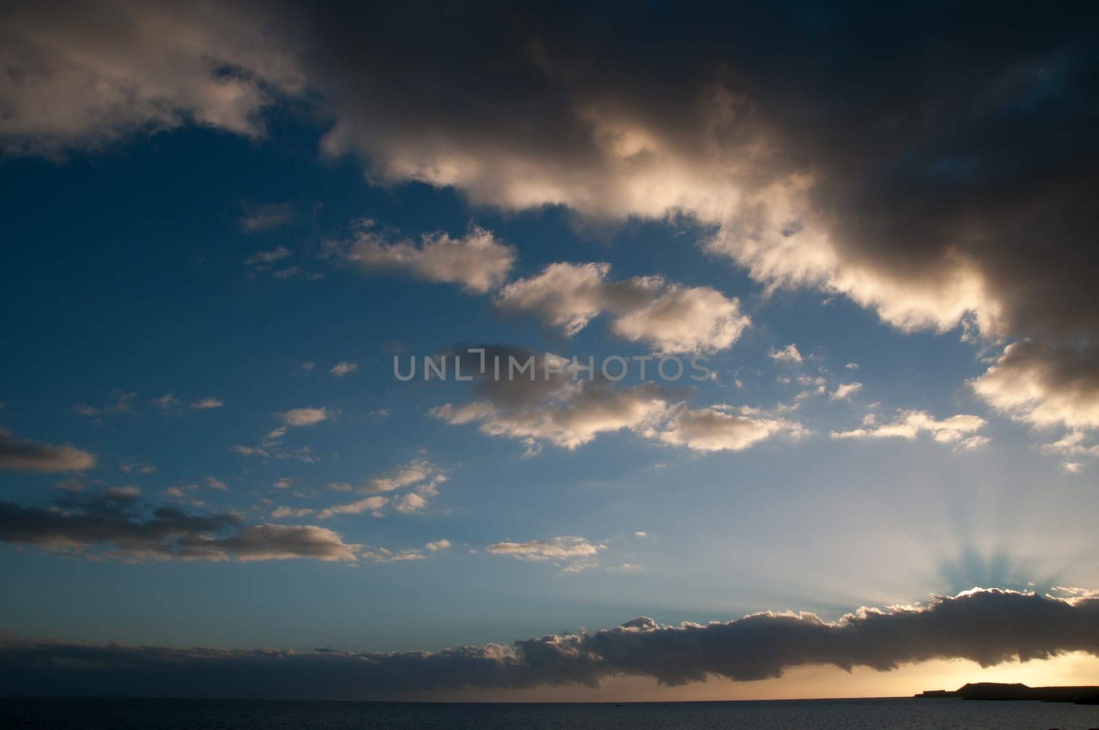 Cloudscape, Colored Clouds at Sunset near the Ocean