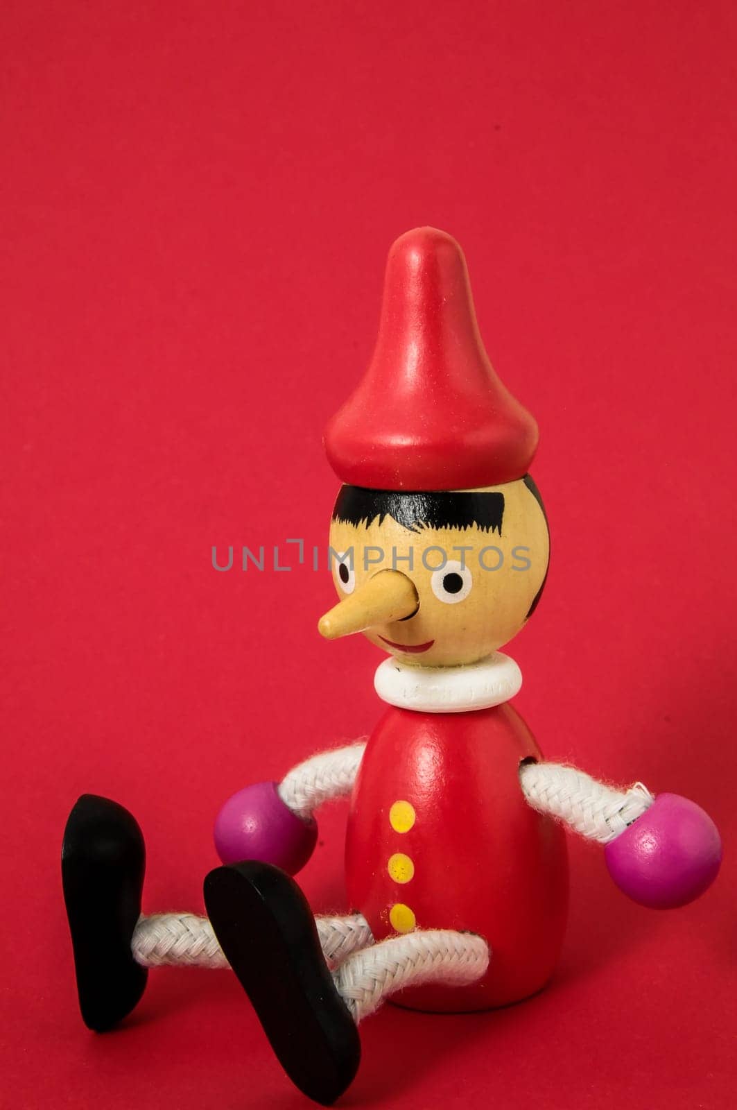 Pinocchio Toy Statue on a Colored Background