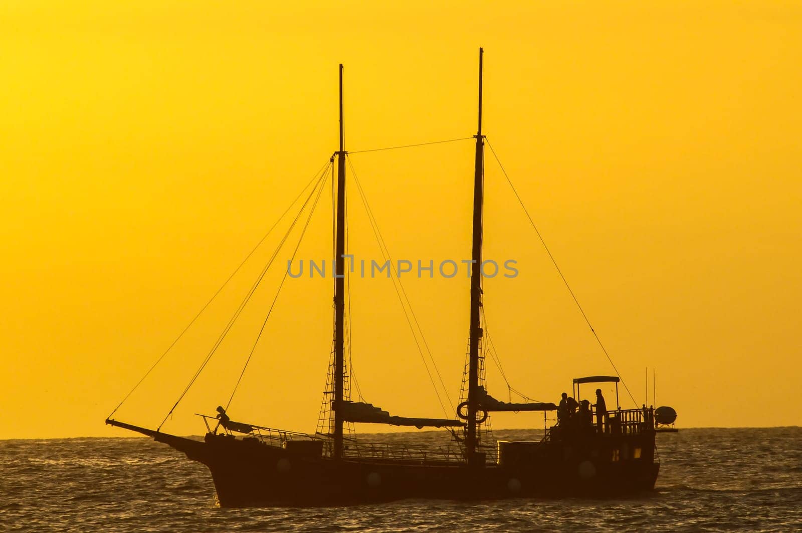 Antique Vintage Sail Vessel on the Ocean at Sunset