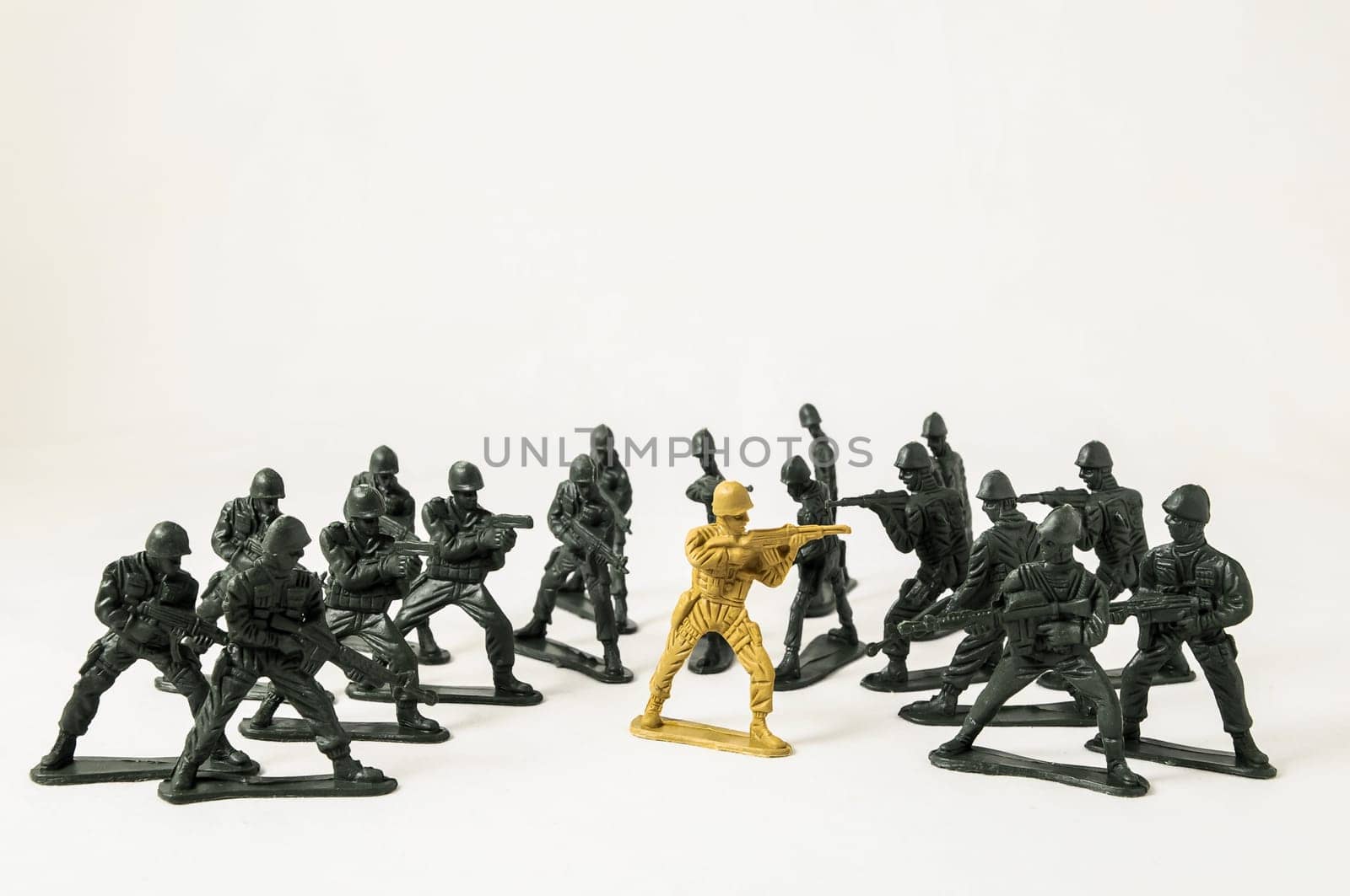 Plastic Lead Soldiers Representing War on a White Background