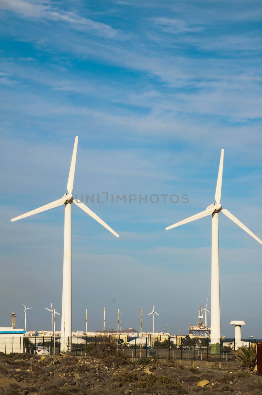 Eletric Power Generator Wind Turbine over a Cloudy Sky
