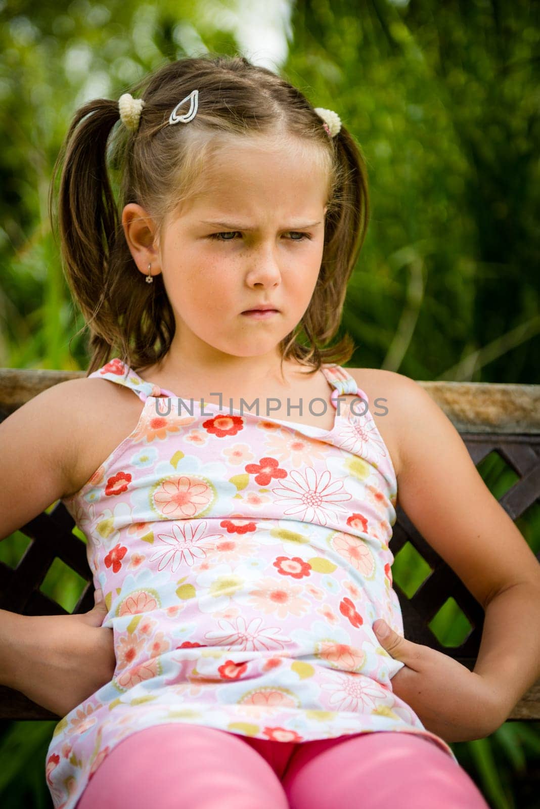 Portrait of small offended child - outoor in backyard