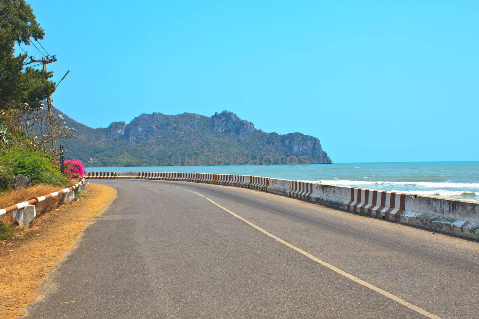 A curve road is leading to the beach
