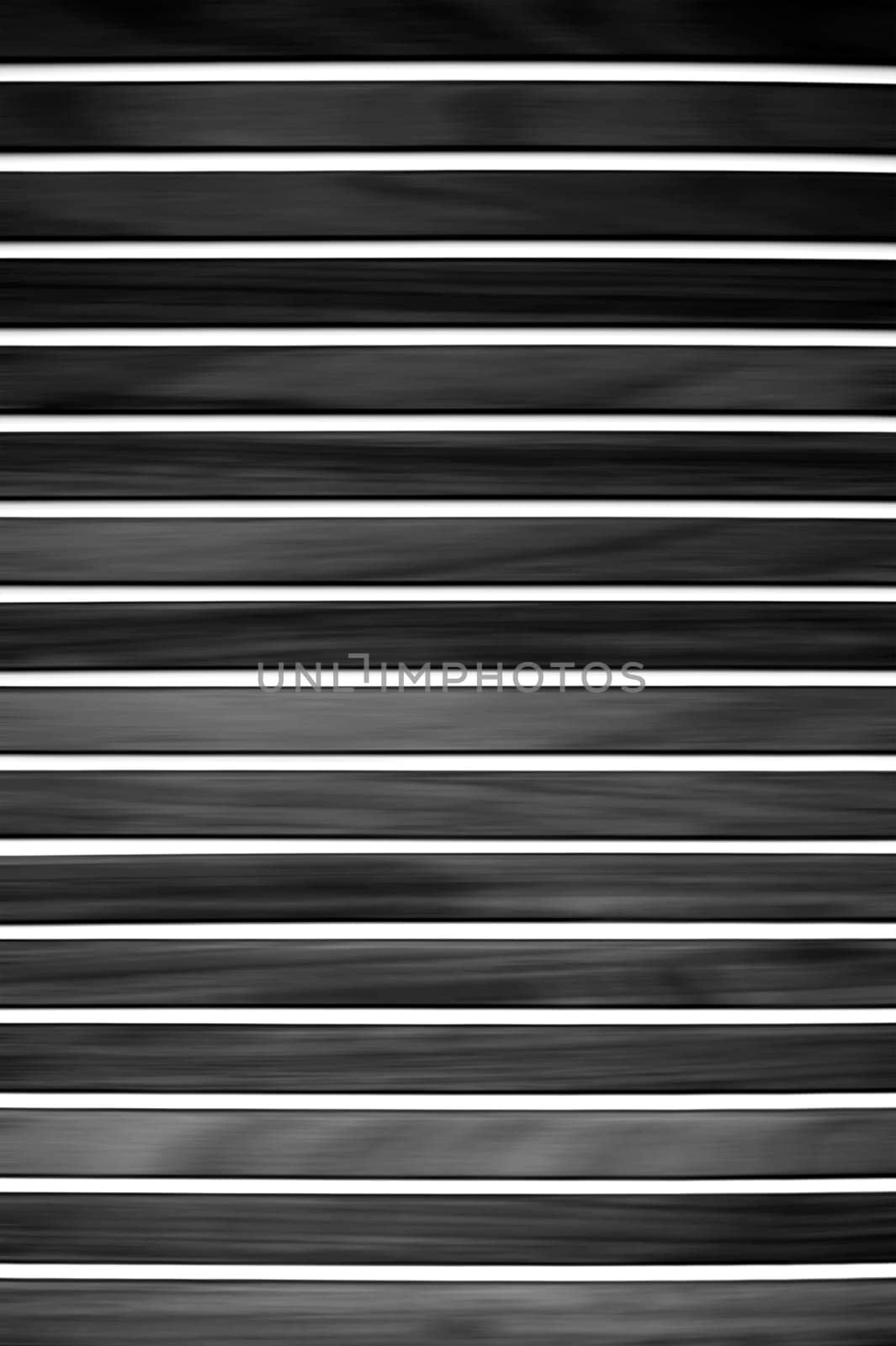 The photograph of a modern,black and white striped wood paneling.