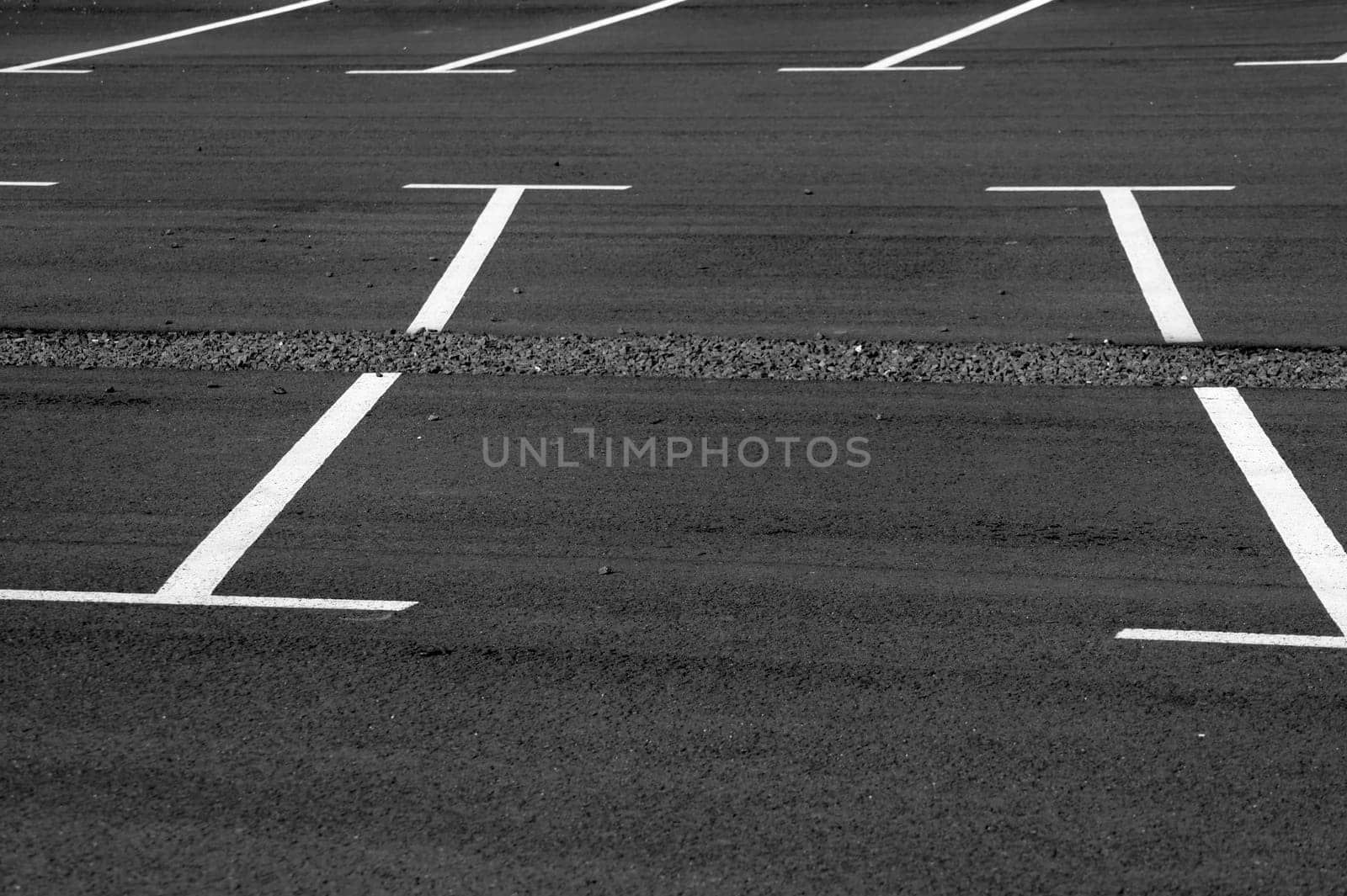 The photograph of a parking lot with parking spaces
