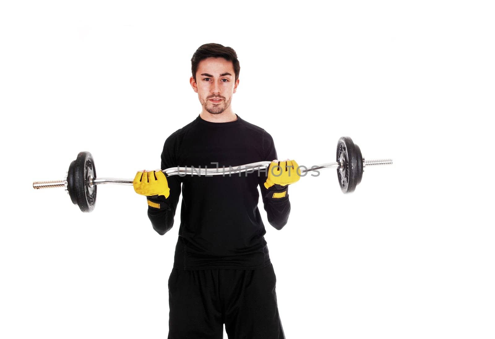 A young man in exercise outfit lifting weight for white background..