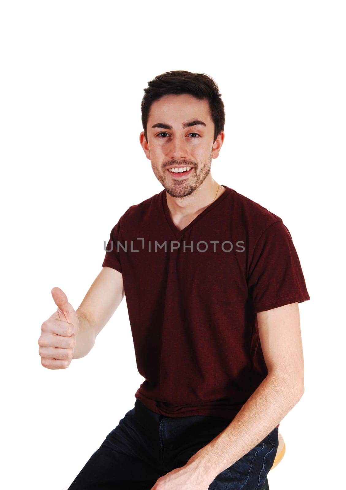 A handsome good looking man in a t-shirt, pointing his finger ahead,.for white background..