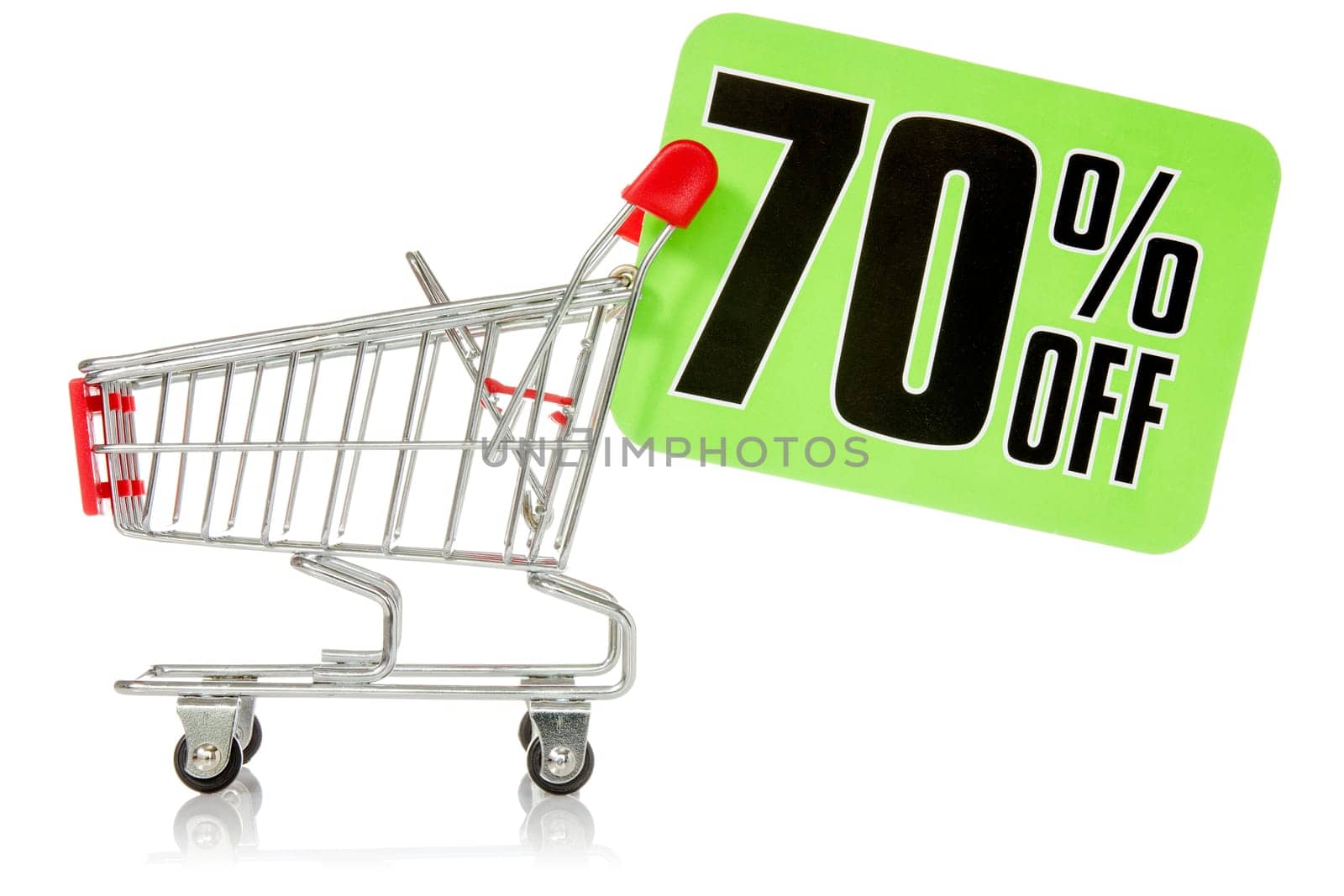 Shopping cart with green sale tag. Isolated on white background