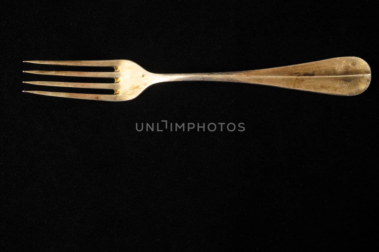 Ancient Vintage Silver Flatware on a Black Background