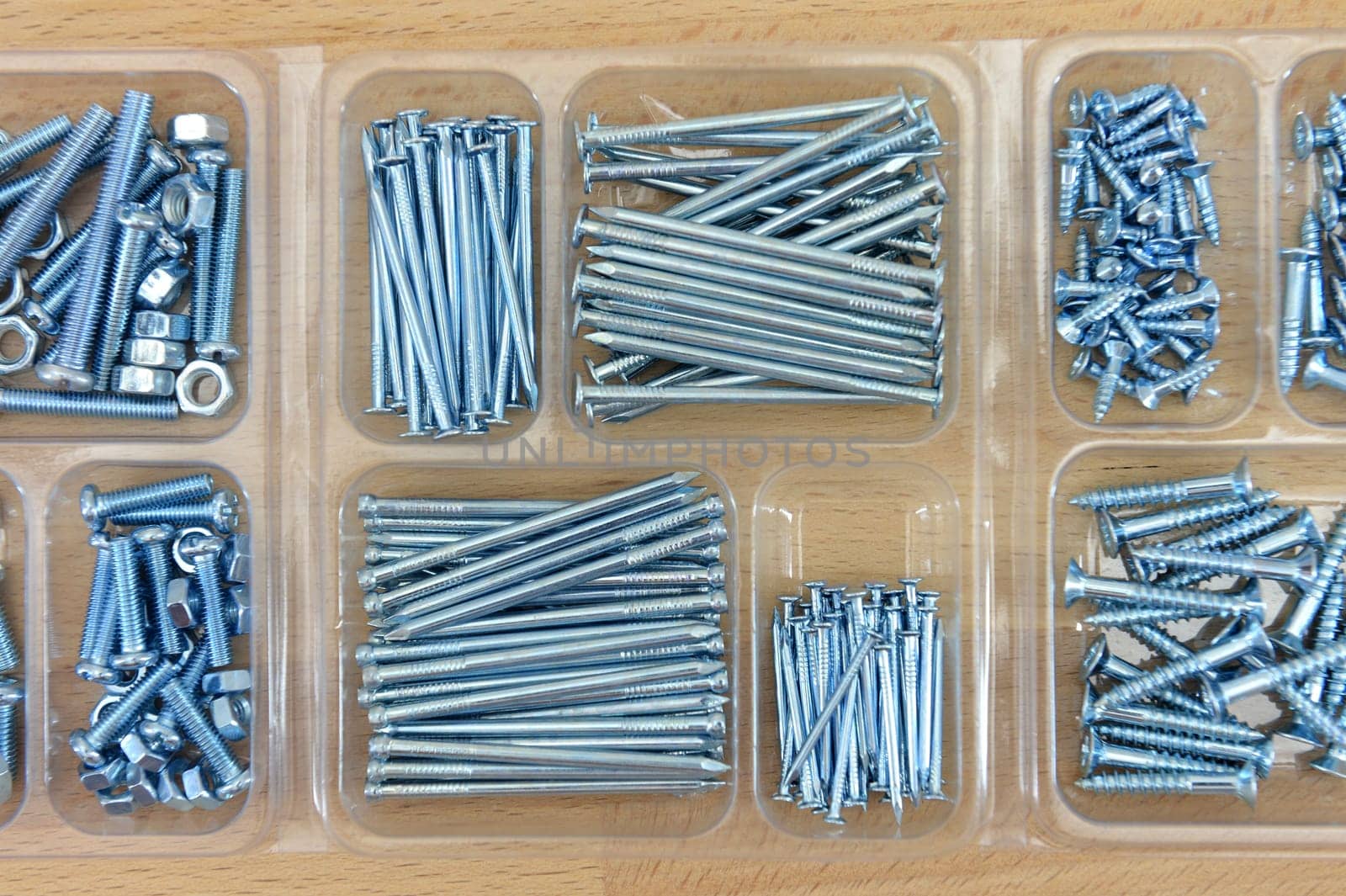 Hardware fixings isolated on a wooden bench