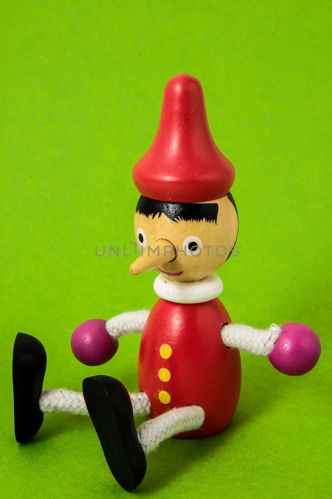 Pinocchio Toy Statue on a Colored Background