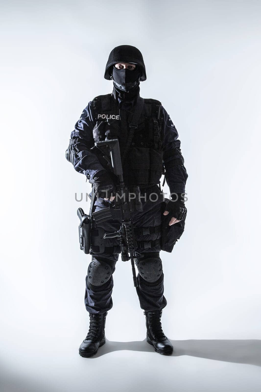 Special weapons and tactics team officer with his gun
