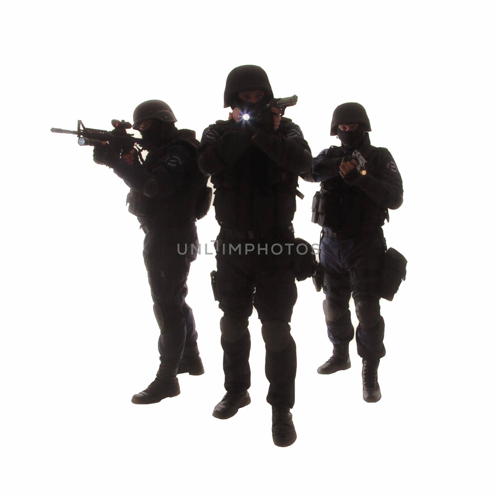 Silhouettes of special weapons and tactics (SWAT) team in action