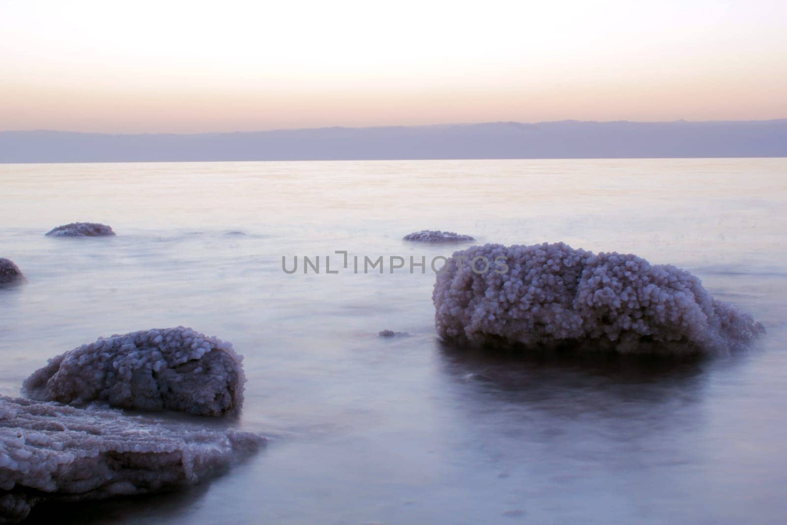 Dead Sea coastline, whit salt crystals and formations in the rocks. Jordan
