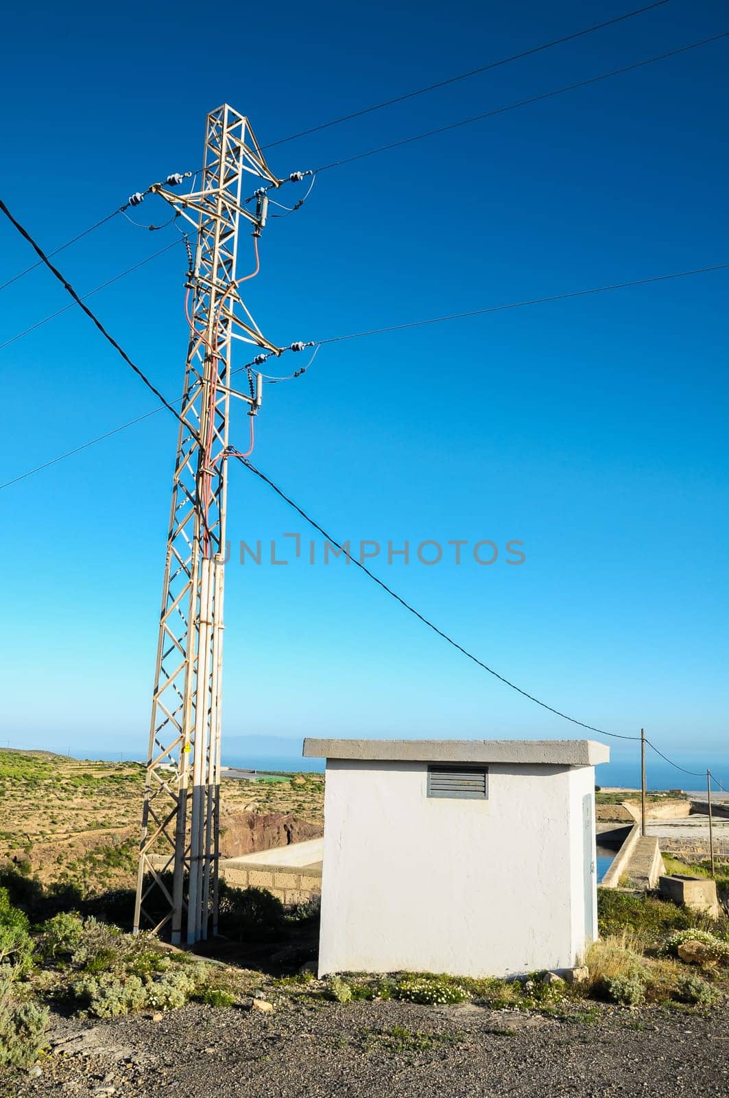 Energy Electricity Power Pylon on a Blue Sky