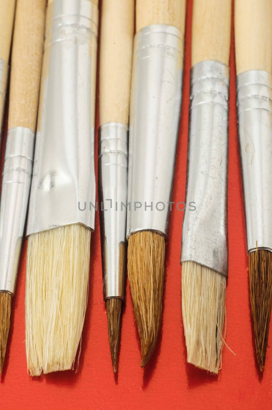 New Wooden Different Paintbrush Set Texture over a Colored Background