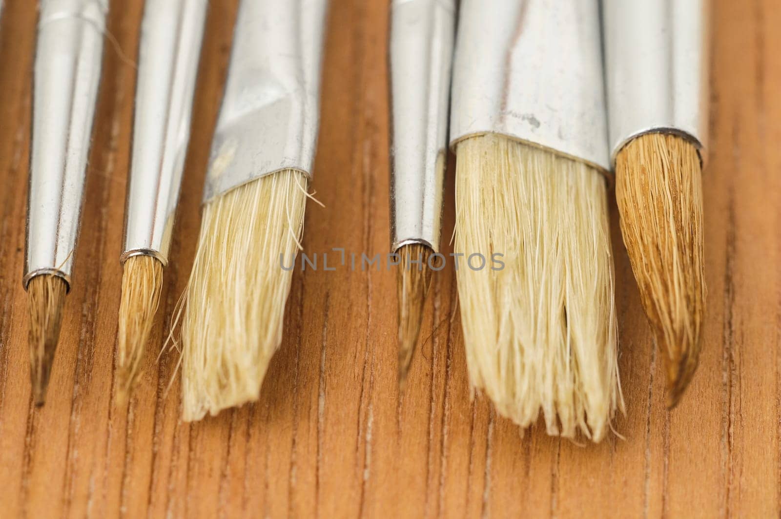 New Wooden Different Paintbrush Set Texture over a Colored Background