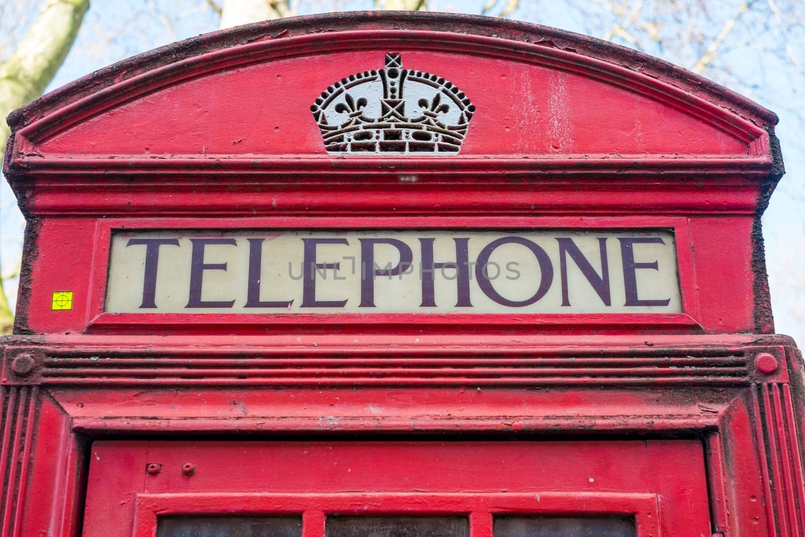 Close up of old red telephone booth in London, UK