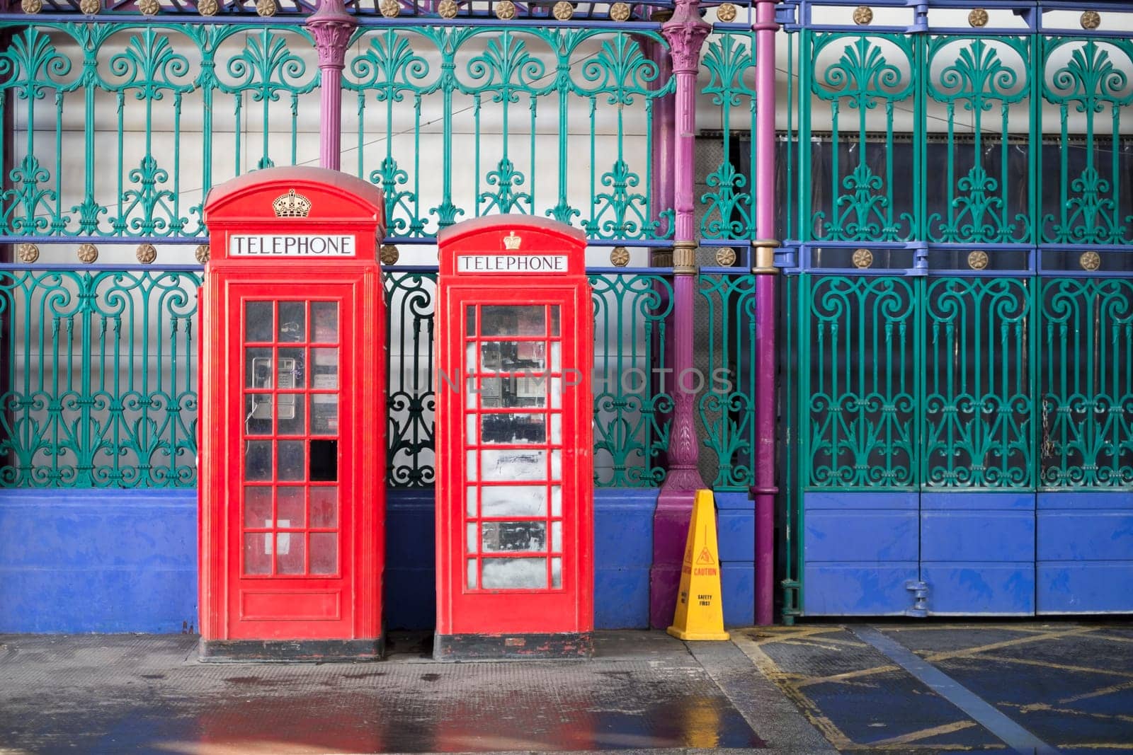 Old red telephone booth in Smithfield meat market in London, UK