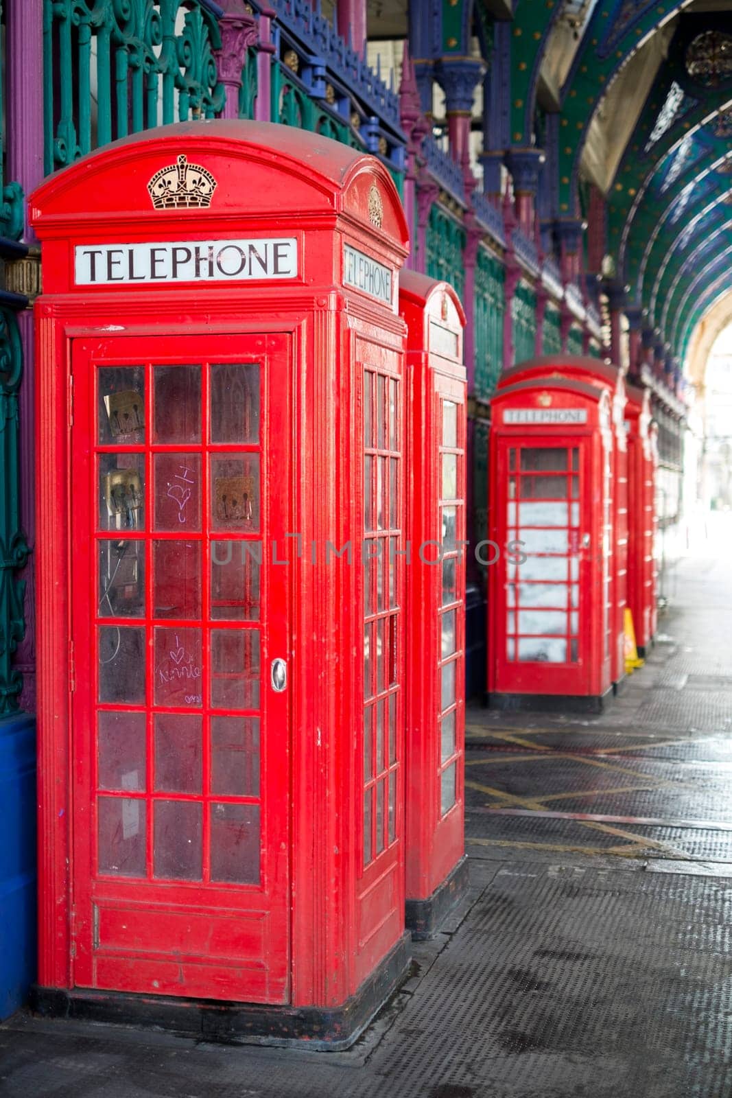 Old red telephone booth in Smithfield meat market in London, UK