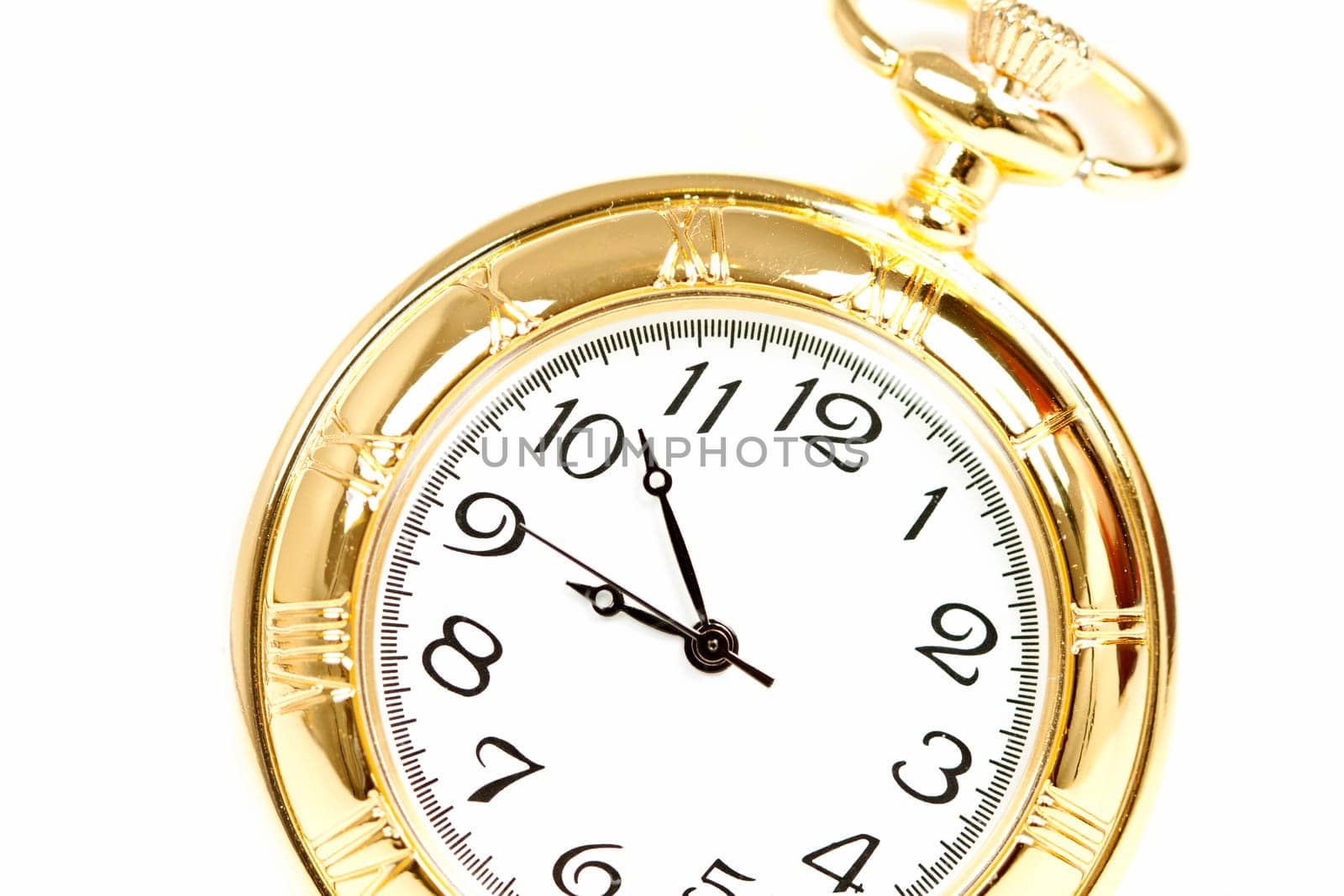 Old styled gold pocket watch on scarlet silk